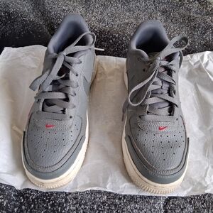 Nike Kids Gray Sneakers with Red Accents